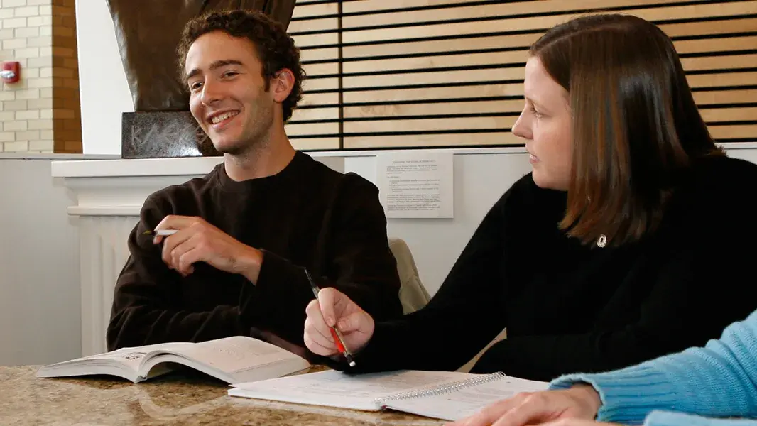 john glenn college of public affairs students in a group discussion at a table