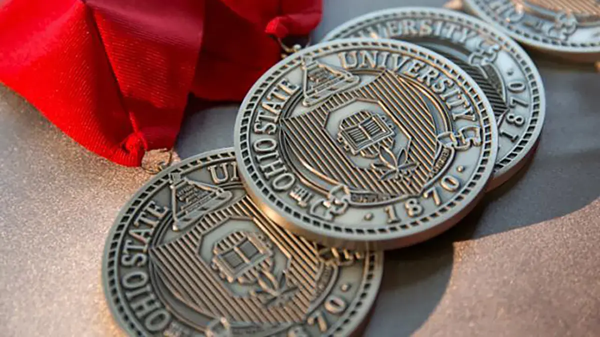 award medals with red crest laying on a table