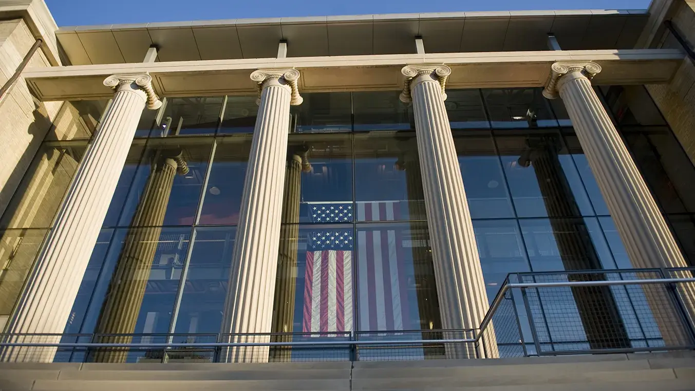 page hall on osu's campus with large pillars in front of tall glass exterior