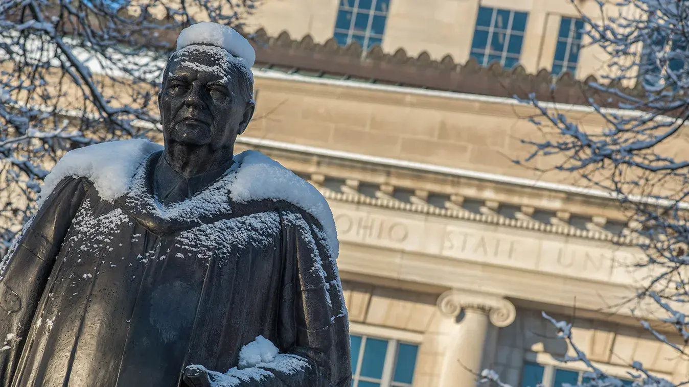 statue in front of the Thompson Library on osu's campus