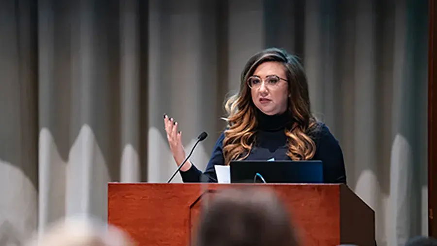 Woman speaking at a podium