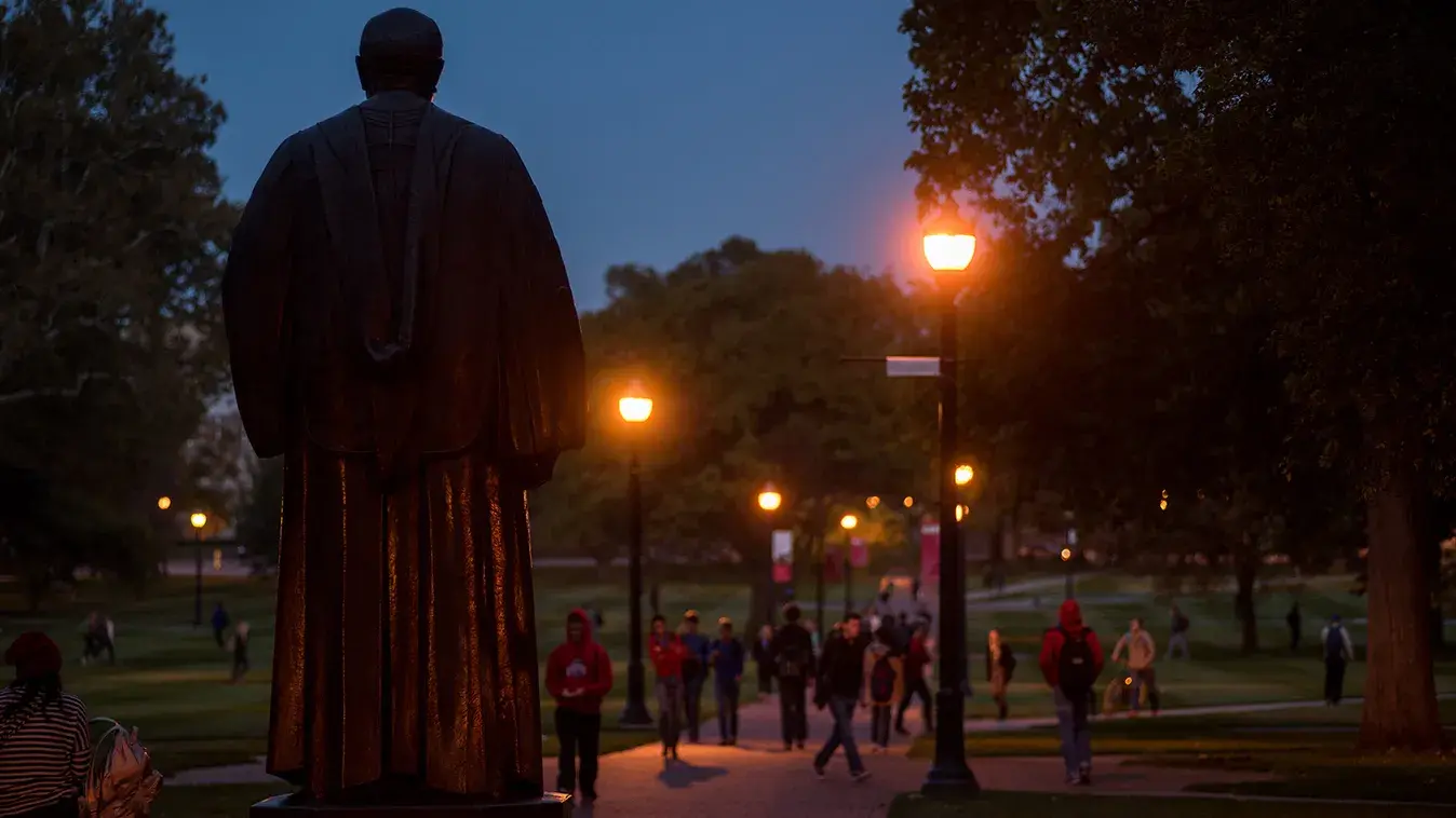 statue on ohio state's campus at night