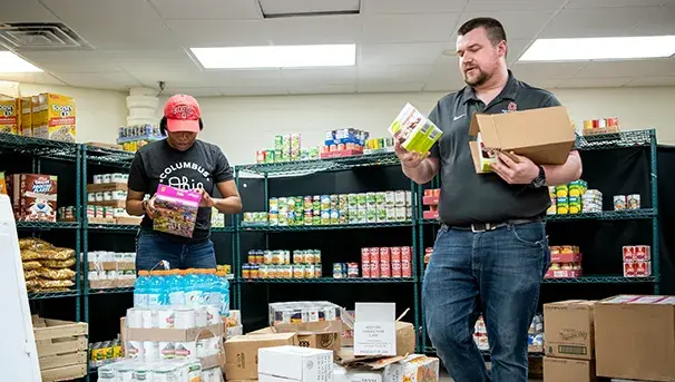 people working in a food pantry