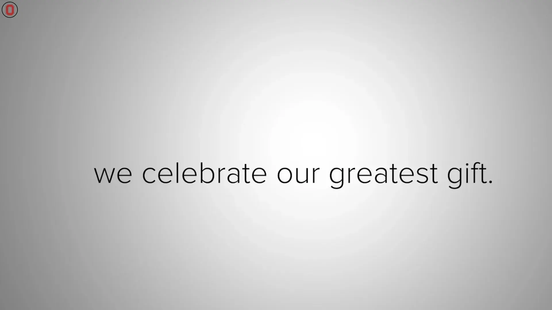 white and gray image with the text we celebrate our greatest gift centered in the middle