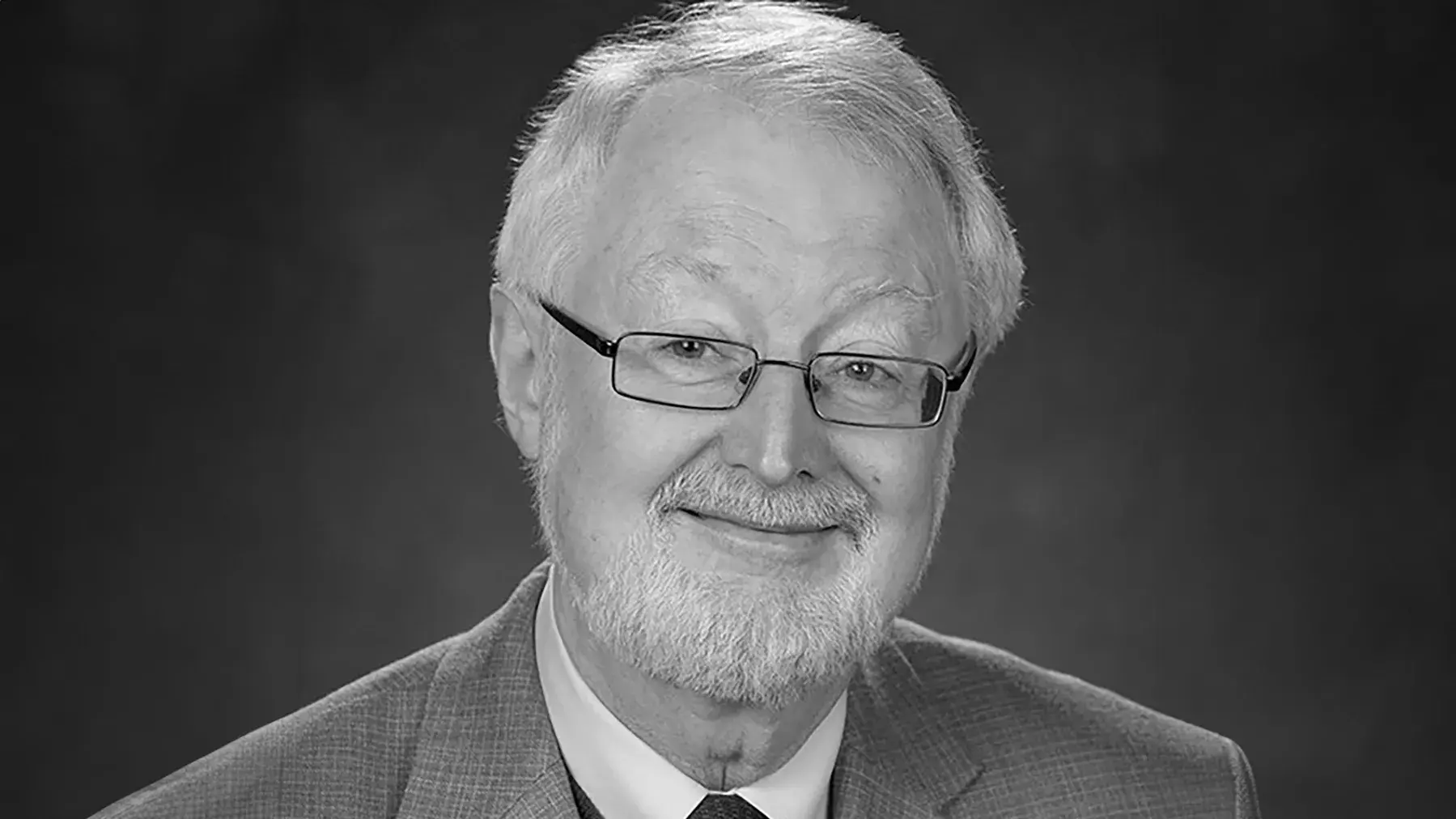 black and white portrait of A. Douglas Kinghorn, PhD wearing a suit and tie