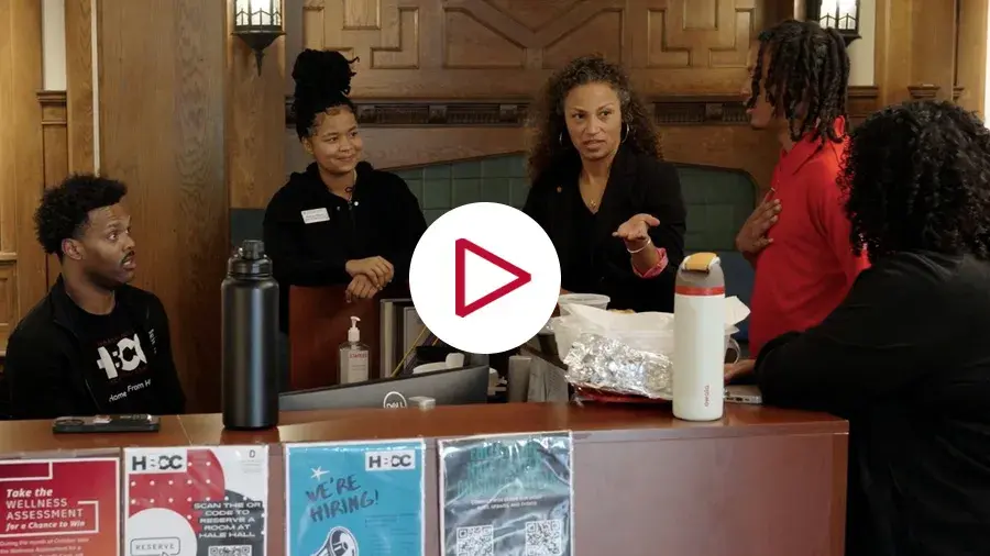 Young Scholars Program group stand together and talk