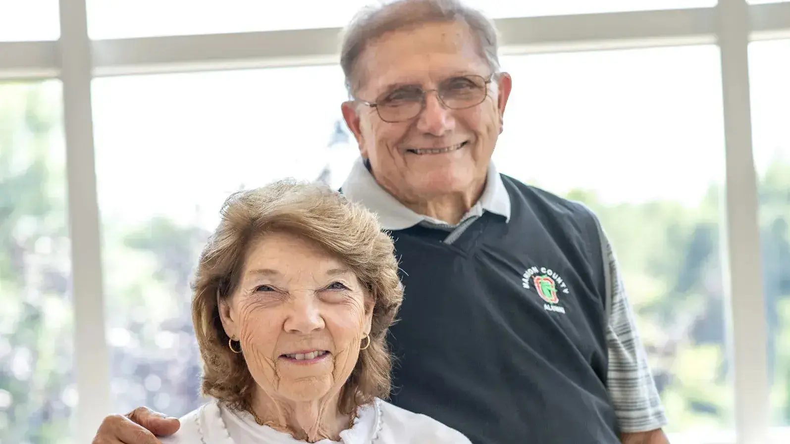 Ted and Marlene Temple sit and smile for the camera