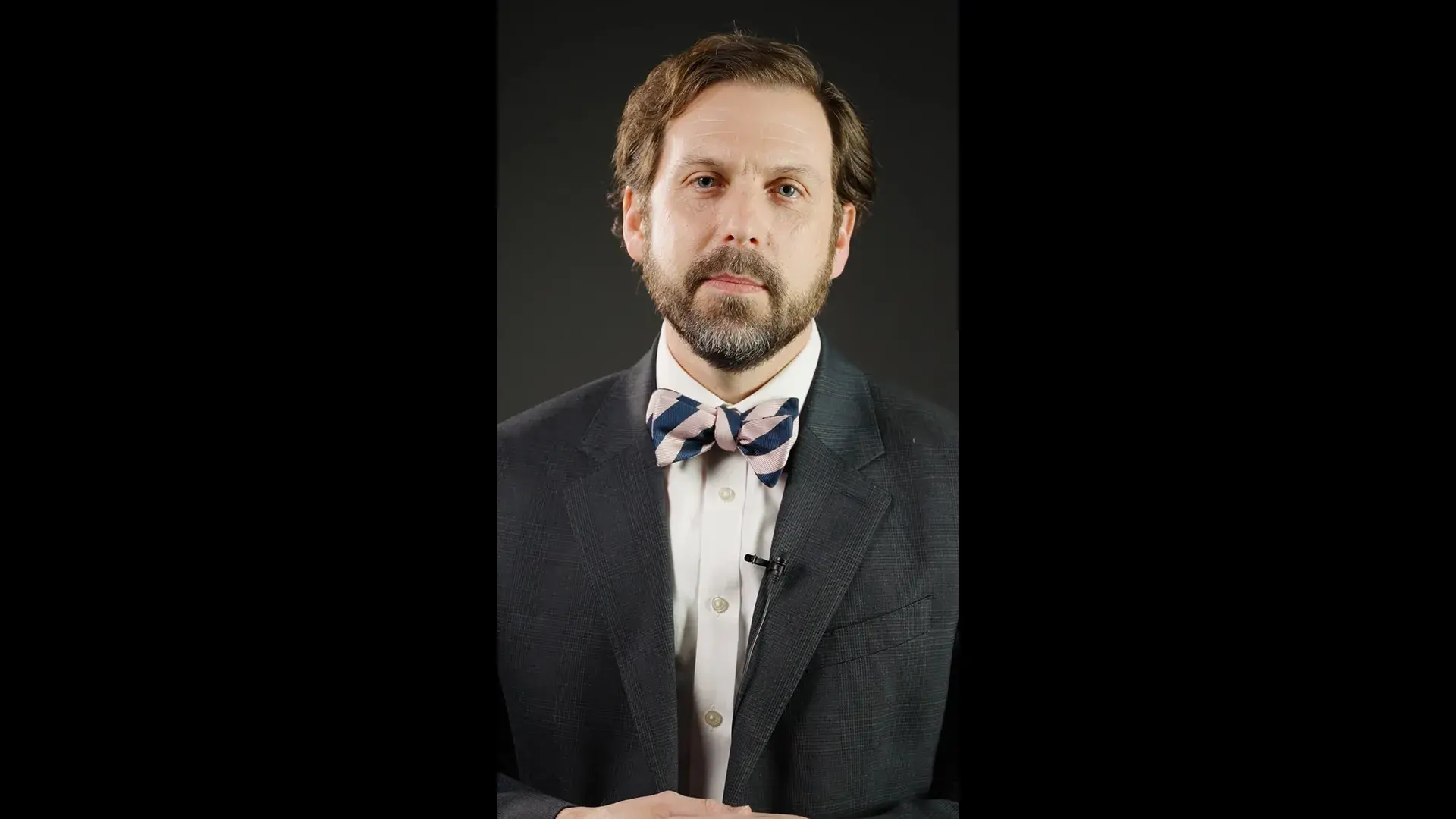 man in a black suit with a bow-tie