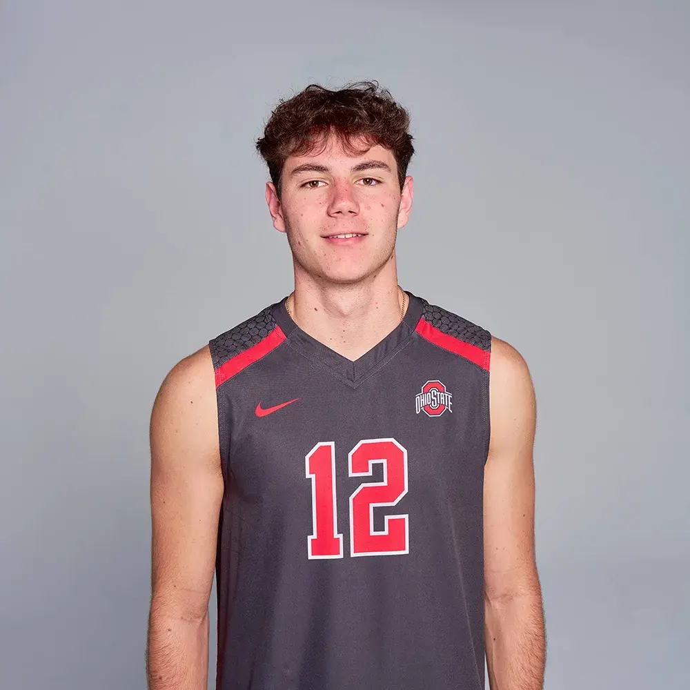Ian Nolte posing in a gray Ohio State volleyball uniform with a gray background.