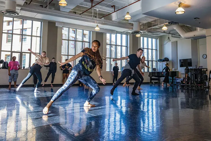 A group of people dance in a class