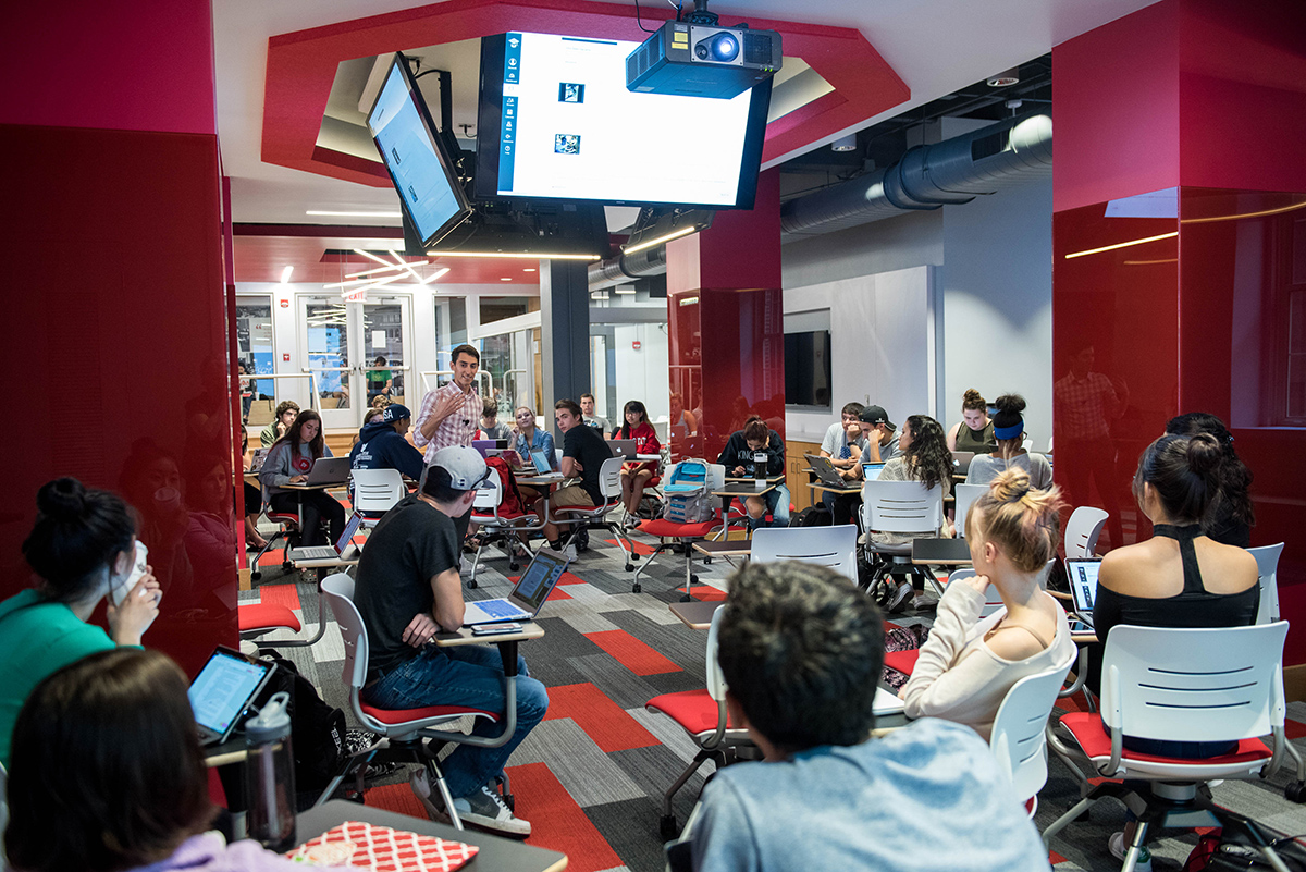 A faculty member instructs while surrounded by a number of students in Ohio State’s Innovation Space.