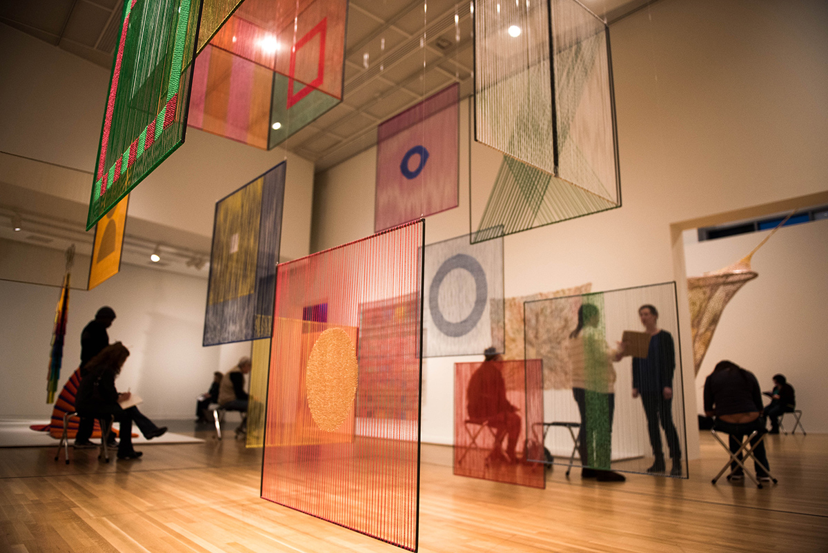 Visitors observe art at the Wexner Center for the Arts.
