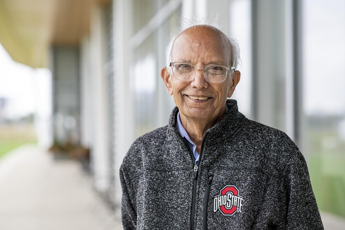 Headshot of Dr. Rattan Lal wearing clear glasses and a pullover with the Ohio State logo