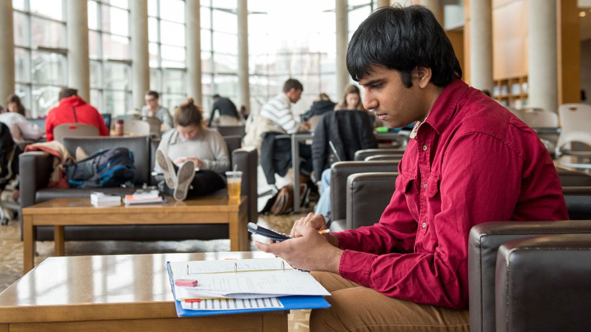 A student using a calculator.