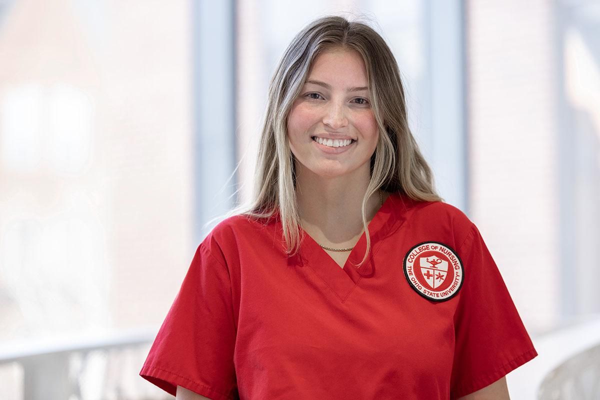 Jordan Dallas headshot in nursing scrubs