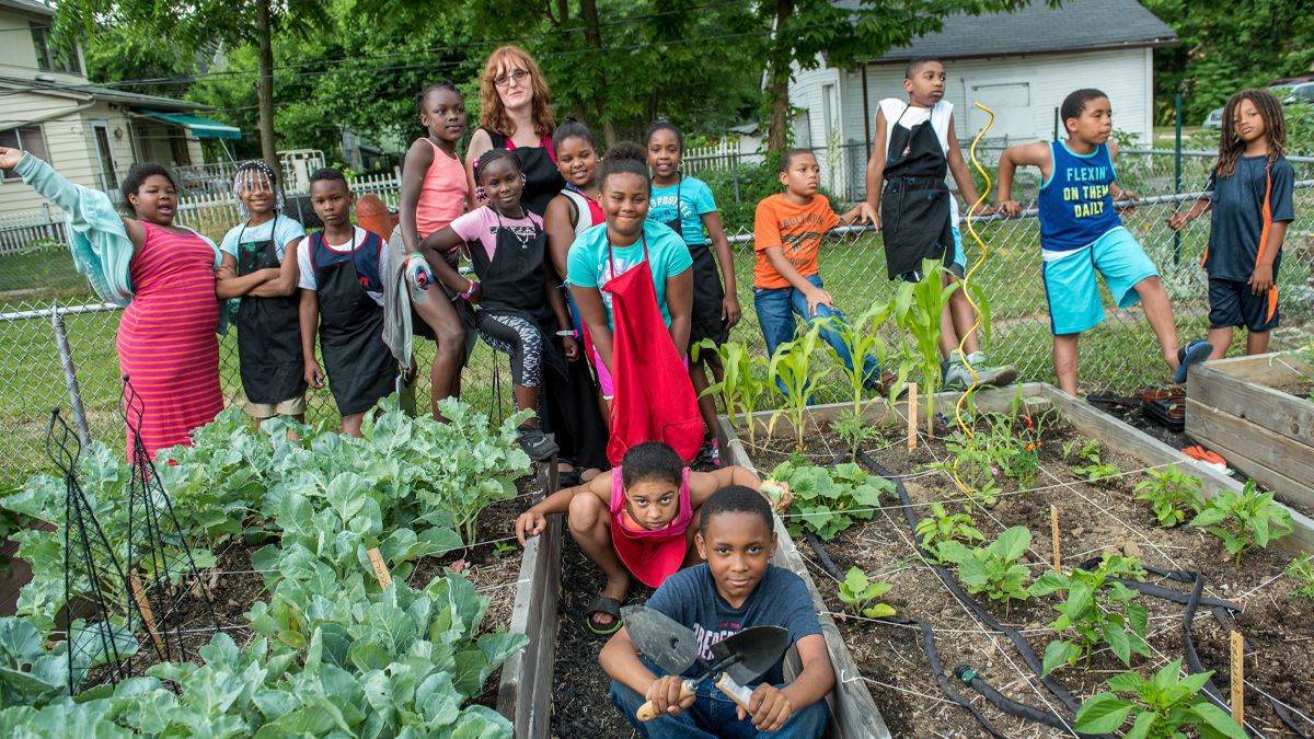 Deanna Wilkinson and children in a garden