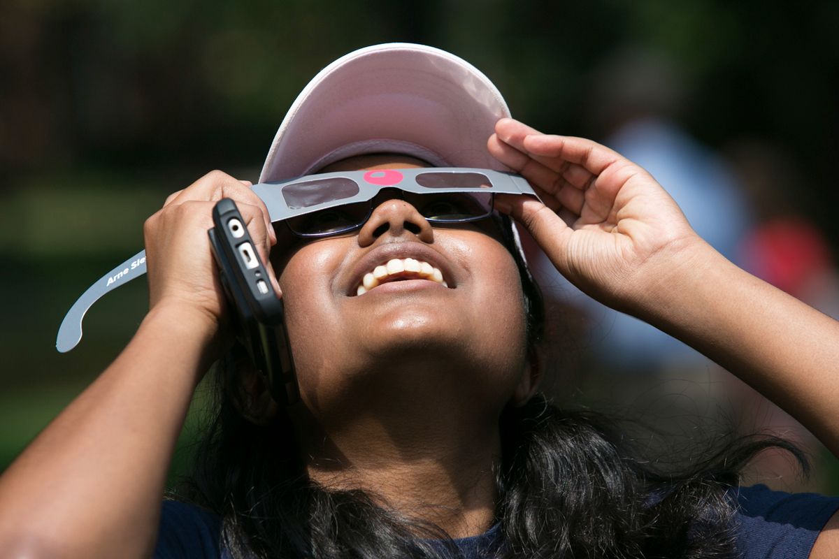 A student using eclipse glasses during the 2017 eclipse