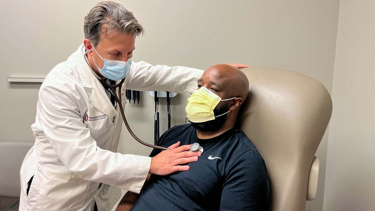 Dr. Ernest Mazzaferri Jr. examines patient Marcus Wright.