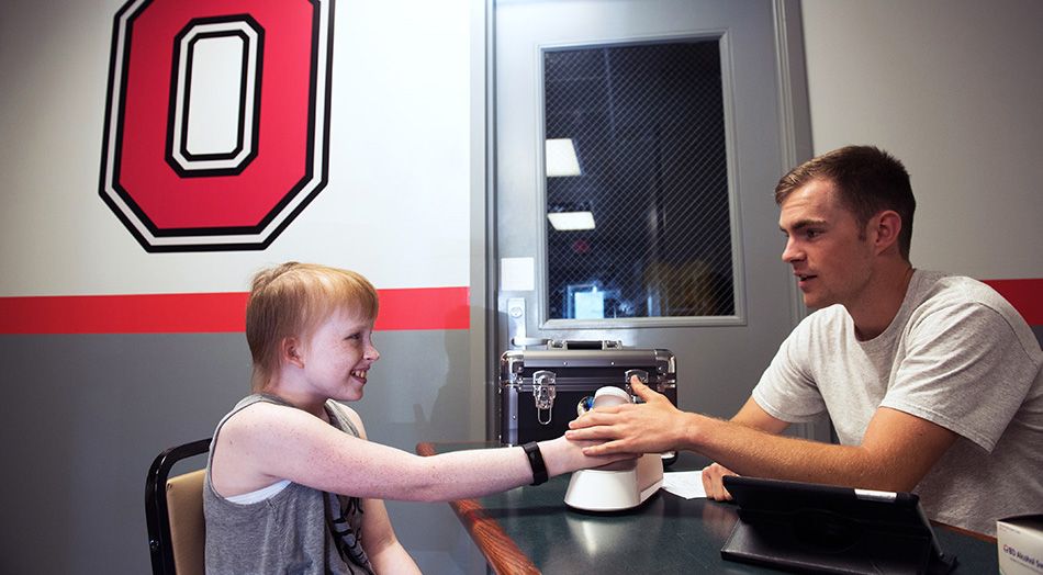 Jeff Laubert working with 11-year-old cancer survivor Cailea Williams
