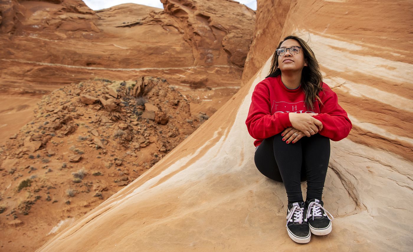 Christina Knight sitting with a desert background.