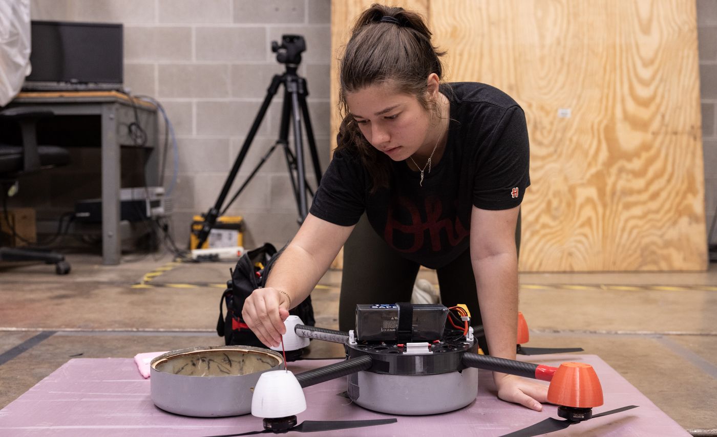 A student works on a drone.