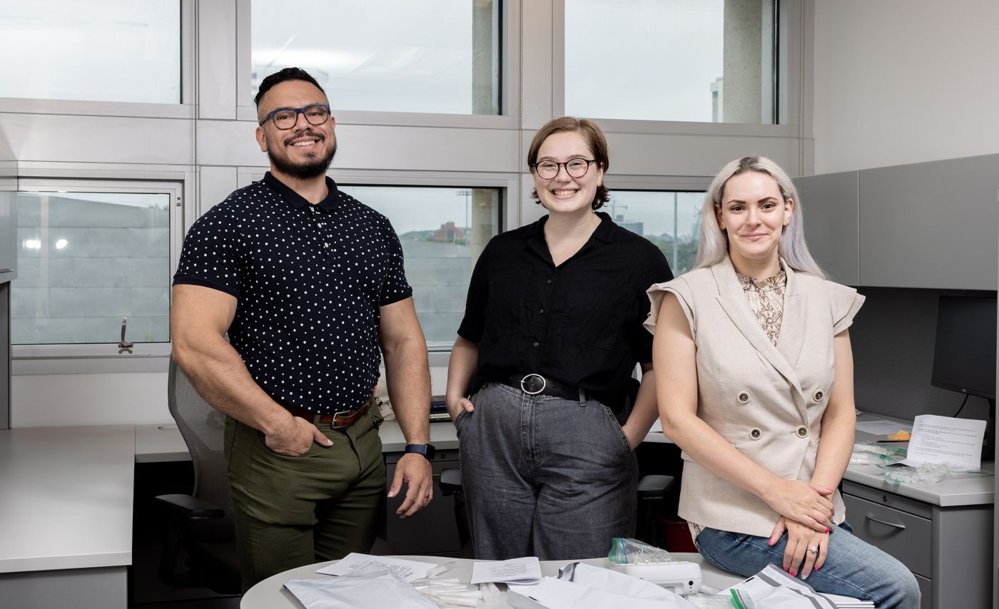 Wilson Figueroa, Bucky Foster and Courtney Taylor pose in their College of Public Health office.