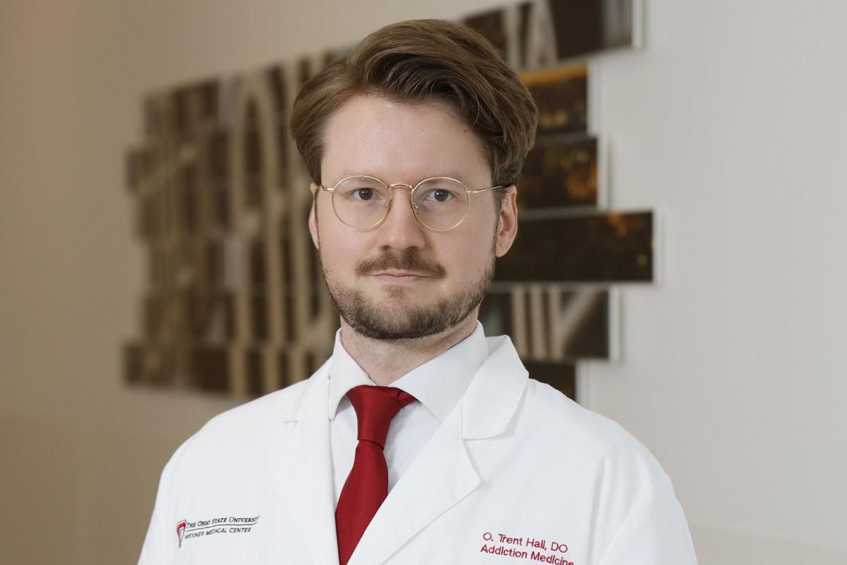 Orman Trent Hall headshot in a lab coat