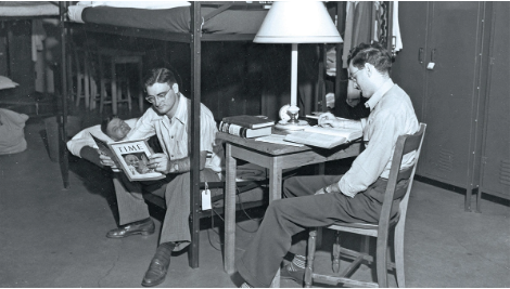 Two men sit in the 'Shoe dorms.