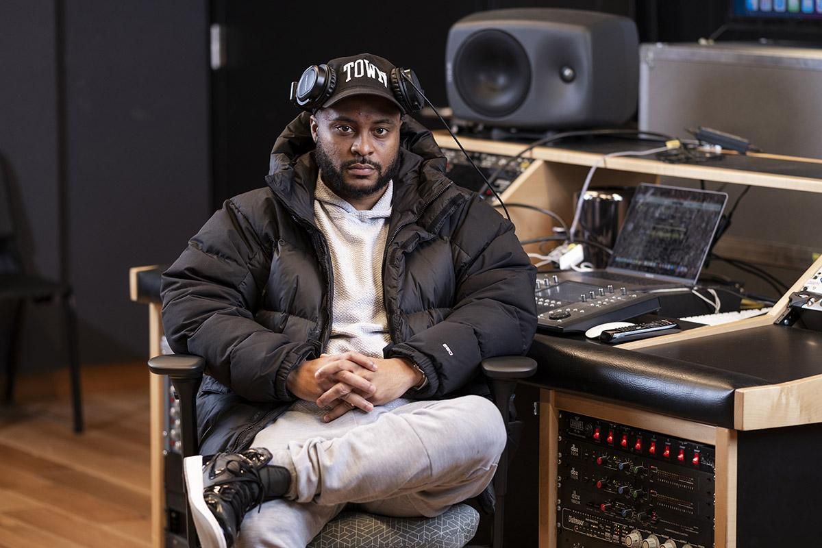 Stevie ‘Dr. View’ Johnson sits in a chair in a recording studio