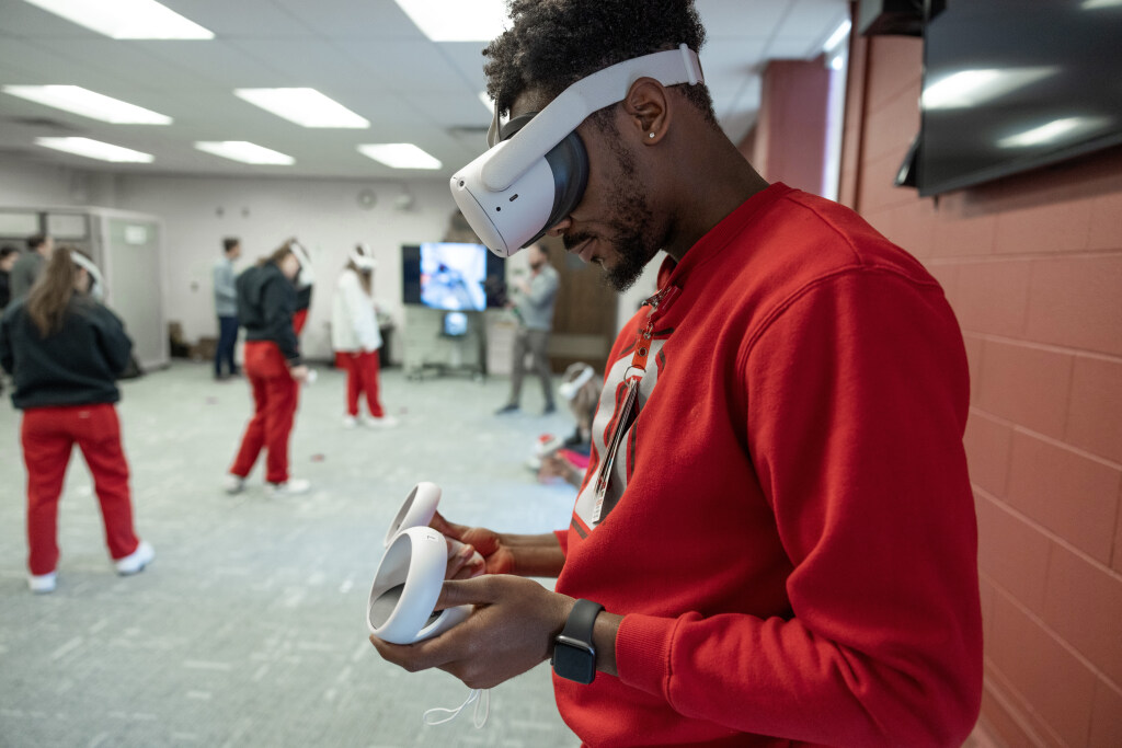 Male student participating in virtual reality during a nursing class