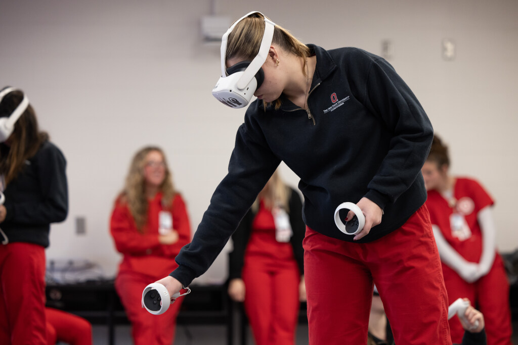 Female student participating in virtual reality during a nursing class