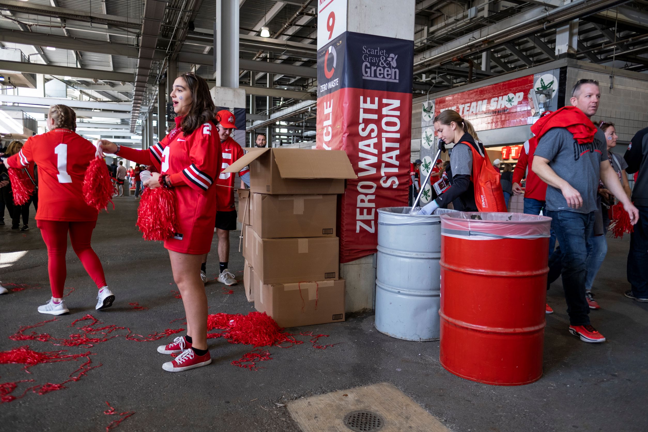 Students sorting waste into Zero Waste bins inside Ohio Stadium