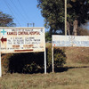 Roadside signs for Kumuzu Central Hospital and Umoyo wa Thanzi partner University of Malawi College of Medicine (Photo by Abigail Norris Turner)